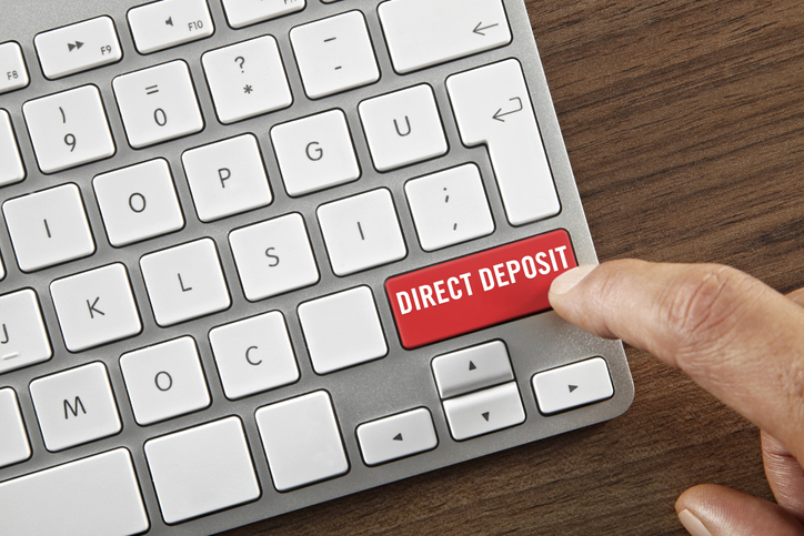 hand clicking on an enter key saying"Direct deposit"